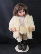 A porcelain doll 'Molly' marked DMS to neck.