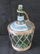 A glass bottle in wicker.