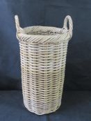 A wicker umbrella / stick stand.