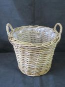 A wicker waste paper basket.
