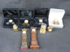 A quantity of miniature clocks.