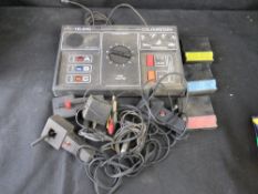 A Teleng console with cartridge games and controllers.