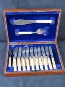 Silver plated fish knives and forks in box.