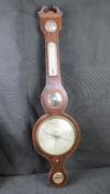 A 19th century cased wheel barometer, the swan necked pediment above a a shaped boxwood inlaid case,