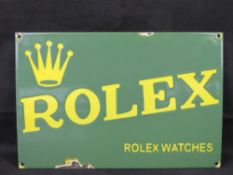 A fine reproduction Rolex Watch shop advertising tin and enamel sign.