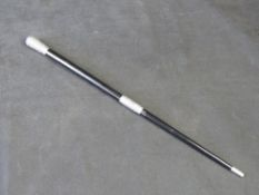 An antique silver mounted conductors ebonised baton of tapering form.