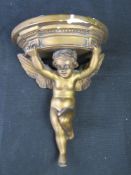 A gilded plaster Cherub corbel or shelf.