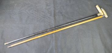 Two walking canes with silver mounts