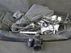 A Canon Powershot SX60 HS camera and lighting accessories in bag.