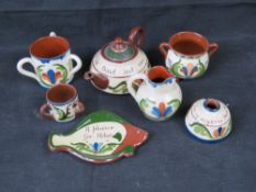 Torquay / Devon motto ware pottery; various items with floral design, various marks.
