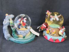 Two Disney snow globes; Peter Pan and Dumbo (a/f).