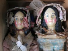 A pair of original early 19th century papier mache shoulder head dolls c1830 with finely painted