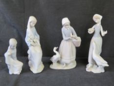 Four Lladro figurines.