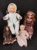 Four assorted bisque and porcelain headed dolls, with two chairs.