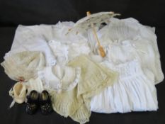 A quantity of Christening robes and dolls accessories.