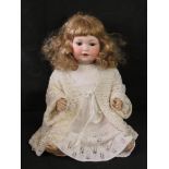 An Armand Marseilles bisque head doll, A.7.M, 971a, having sleepy eyes, open mouth and rosy cheeks.
