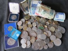A quantity of assorted coinage and bank notes including some commemorative.