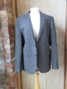 A woolen jacket, no labels.