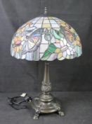 A large Tiffany style leaded glass table lamp with butterfly pattern.