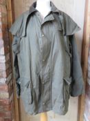 A waxed cotton jacket by Game size L.