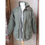 A 70% wool tweed jacket by Woodstock,