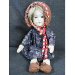 A small Ernst Heubach doll 407.15? having brown eyes, open mouth and cloth body.