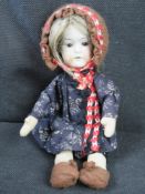 A small Ernst Heubach doll 407.15? having brown eyes, open mouth and cloth body.