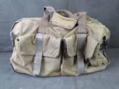 A Barbour waxed cotton weekend bag.