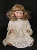 An Armand Marseilles bisque head doll, A.7.M, 971a, having sleepy eyes, open mouth and rosy cheeks.
