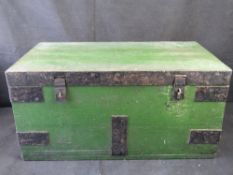 A pained wooden and iron banded trunk.