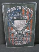 A contemporary pressed metal sign.