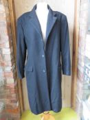 An 80% wool, 10% cashmere black evening coat by Thomas Nash, size M.