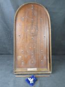 A Corinthian 21T wooden bagatelle board, height 76cm, width 39cm, with balls.