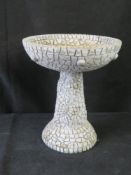 A contemporary tabletop bird bath.