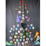 A Scouts poncho having various badges upon.
