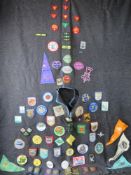 A Scouts poncho having various badges upon.