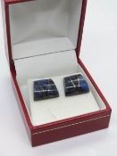A pair of silver and lapis lazuli earrings in presentation box.