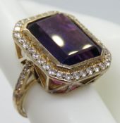 A 925 silver cocktail ring with purple stone, gold plated, size L-M.