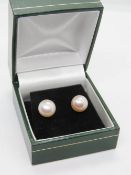 A pair of silver and pearl earrings in presentation box.
