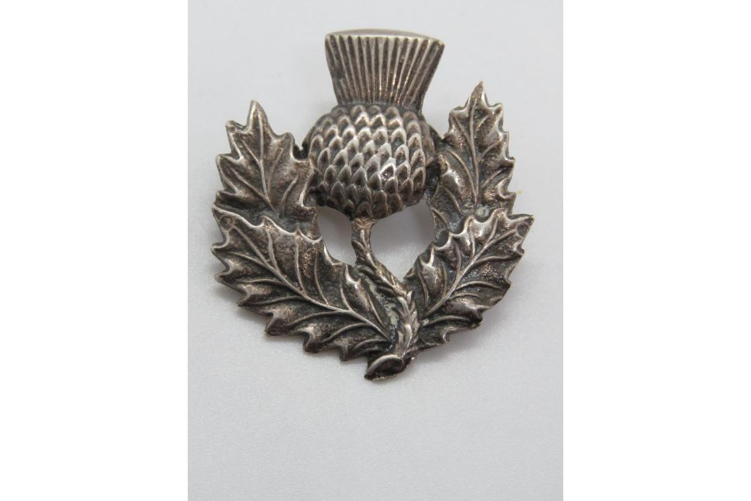 A silver Scottish thistle brooch. - Image 1 of 2