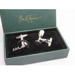A pair of Ede & Ravenscroft wine bottle and corkscrew themed cufflinks in presentation box.