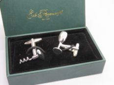 A pair of Ede & Ravenscroft wine bottle and corkscrew themed cufflinks in presentation box.