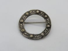 A silver Celtic style wreath brooch hallmarked for Chester.