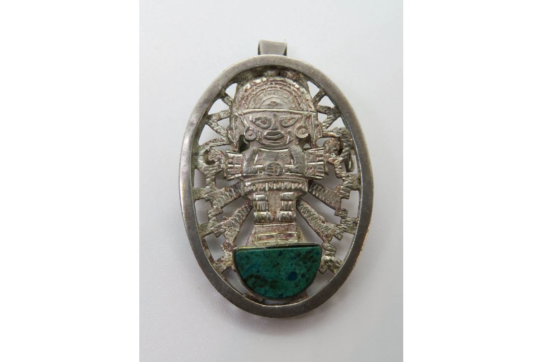 A Mexican silver brooch or pendant in Aztec style with green stone upon. - Image 1 of 2