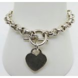 A heavy silver charm bracelet with heart tag, hallmarked 925, 31.5g.