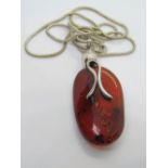 A large Barlic amber and silver pendant, with white metal chain, pandant approx 5.5cm inc bale.