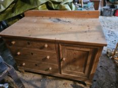 A pine sideboard having three drawers and single cupboard, 116 x 62 x 89cm.