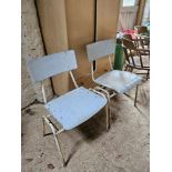 Two mid century stacking chairs.
