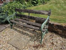 A garden bench with cast iron ends, approx 152cm wide.