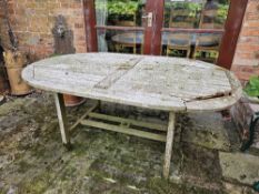 A wooden garden table for restoration, 170 x 110cm.